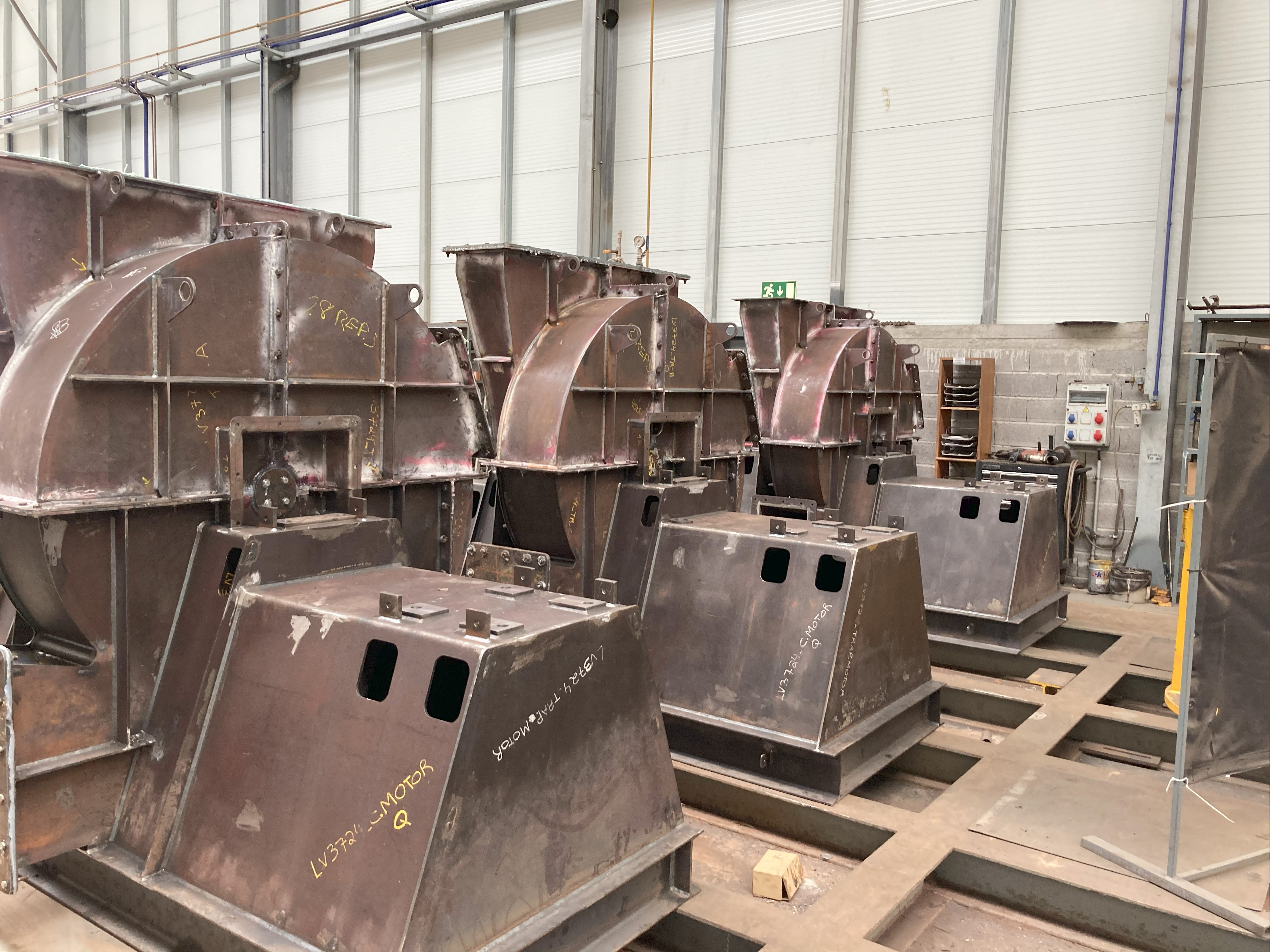 Multiple industrial fan housings in production line